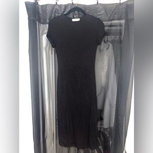 Very soft, slimming material. Size small. Only worn once.